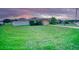 Well-maintained single-story home featuring a spacious green lawn and a white picket fence at 713 Overlook Grove Dr, Winter Haven, FL 33884