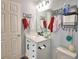 Well-lit bathroom with a white vanity, modern fixtures, and stylish 