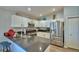 Modern kitchen featuring stainless steel appliances, sleek countertops, and ample cabinet space at 879 Orleans Dr, Eagle Lake, FL 33839