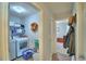 Functional laundry room with a washer, dryer, shelving, and organized storage solutions at 879 Orleans Dr, Eagle Lake, FL 33839
