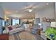 Spacious living area with neutral-toned sofas and seamless transition to the modern kitchen at 879 Orleans Dr, Eagle Lake, FL 33839