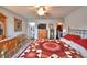 Comfortable main bedroom showcasing a decorative quilt, ceiling fan, and ample closet space at 879 Orleans Dr, Eagle Lake, FL 33839