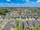 Areal view of neighborhood featuring many similar homes, ponds, and landscaping at 912 Scrub Oak Hammock Rd, Davenport, FL 33837