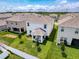 Aerial view of the home showcasing the backyard and covered patio in a neighborhood at 912 Scrub Oak Hammock Rd, Davenport, FL 33837