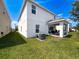 Large grassy backyard featuring covered patio perfect for enjoying the outdoors at 912 Scrub Oak Hammock Rd, Davenport, FL 33837