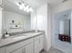 Bathroom featuring double sinks, gray countertops, and plenty of cabinet space at 912 Scrub Oak Hammock Rd, Davenport, FL 33837