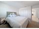 Bright bedroom featuring neutral walls, carpet, and closet for ample storage at 912 Scrub Oak Hammock Rd, Davenport, FL 33837
