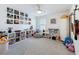 Spacious bedroom area featuring a ceiling fan, soft carpet, and window for natural light at 912 Scrub Oak Hammock Rd, Davenport, FL 33837