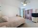 Cozy bedroom with a ceiling fan, soft carpet and stuffed animal decor at 912 Scrub Oak Hammock Rd, Davenport, FL 33837
