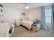 Charming bedroom with plush carpet, ceiling fan and a cozy window seat at 912 Scrub Oak Hammock Rd, Davenport, FL 33837