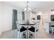 Bright dining room with decorative chandelier and access to kitchen and living area at 912 Scrub Oak Hammock Rd, Davenport, FL 33837