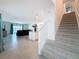 Inviting foyer with staircase leading to a spacious living area at 912 Scrub Oak Hammock Rd, Davenport, FL 33837
