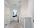 Upstairs hallway showcasing bedroom view and safety gate at 912 Scrub Oak Hammock Rd, Davenport, FL 33837