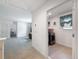 Hallway view to a laundry room and living area at 912 Scrub Oak Hammock Rd, Davenport, FL 33837