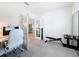 Bright home office with tiled floors, open doorway, desk, and workout equipment at 912 Scrub Oak Hammock Rd, Davenport, FL 33837