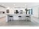 Bright, open kitchen featuring a large center island with seating and modern appliances at 912 Scrub Oak Hammock Rd, Davenport, FL 33837