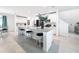 Modern kitchen with a large island, ample countertop space, and sleek white cabinets at 912 Scrub Oak Hammock Rd, Davenport, FL 33837