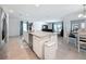 Open-concept kitchen with a large island, stainless steel appliances, and seamless connection to the living area at 912 Scrub Oak Hammock Rd, Davenport, FL 33837