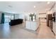 Spacious open layout with large kitchen island, living room, and dining area at 912 Scrub Oak Hammock Rd, Davenport, FL 33837