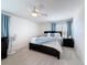 The main bedroom is spacious with plush carpet, neutral paint and has a ceiling fan at 912 Scrub Oak Hammock Rd, Davenport, FL 33837