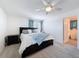 The main bedroom features a ceiling fan, plush carpet, and is freshly painted at 912 Scrub Oak Hammock Rd, Davenport, FL 33837