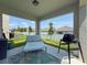 Covered patio featuring a lounge chair, outdoor rug and grill perfect for entertaining at 912 Scrub Oak Hammock Rd, Davenport, FL 33837