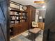 Bedroom featuring a barn door, dark wood built-ins, and charming nautical decor for a unique touch at 9402 Cat Track Trl, Lake Wales, FL 33898