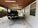 Spacious carport with truck parked inside, offering ample covered parking at 9402 Cat Track Trl, Lake Wales, FL 33898