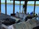 Covered dock lounge area with views of the lake at 9402 Cat Track Trl, Lake Wales, FL 33898