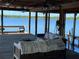 Relax on the covered dock with comfortable outdoor furniture at 9402 Cat Track Trl, Lake Wales, FL 33898