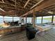 Lakefront dock with seating and boat slip, ideal for enjoying waterfront activities and scenic views at 9402 Cat Track Trl, Lake Wales, FL 33898