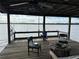 Relaxing covered dock features fishing equipment and views of the lake at 9402 Cat Track Trl, Lake Wales, FL 33898
