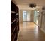 Bright living room with sliding glass doors and light hardwood floors at 9402 Cat Track Trl, Lake Wales, FL 33898