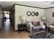 Open floor plan featuring tiled floors, mirrors, and a daybed in living room at 9402 Cat Track Trl, Lake Wales, FL 33898