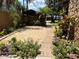 Charming stone home featuring a patio with outdoor grill and lounge chairs overlooking the water at 9402 Cat Track Trl, Lake Wales, FL 33898