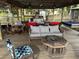 This relaxing covered dock features comfortable seating and views of the lake at 9402 Cat Track Trl, Lake Wales, FL 33898