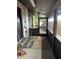 Covered patio with decorative flooring and outdoor access at 9402 Cat Track Trl, Lake Wales, FL 33898