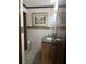 Well-lit powder room with a decorative vanity and a stylish mirror and decor at 9402 Cat Track Trl, Lake Wales, FL 33898