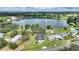 Stunning aerial view of a lakefront property with mature trees and a charming home, a true nature lover's paradise at 1042 Golden Bough Rd, Lake Wales, FL 33898