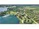Aerial view of lakefront home near surrounding farmland and lake at 1042 Golden Bough Rd, Lake Wales, FL 33898