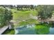 Lakeside view of the property's waterfront backyard with a dock and tranquil atmosphere at 1042 Golden Bough Rd, Lake Wales, FL 33898