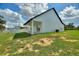Spacious backyard featuring a manicured lawn, a large, covered patio, and serene views at 1042 Golden Bough Rd, Lake Wales, FL 33898