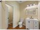 Bathroom with modern vanity, framed mirror, and tile floors at 1042 Golden Bough Rd, Lake Wales, FL 33898