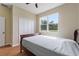 Comfortable bedroom with a ceiling fan and a window providing ample natural light at 1042 Golden Bough Rd, Lake Wales, FL 33898