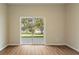 Bedroom featuring wood floors and sliding glass doors to the backyard at 1042 Golden Bough Rd, Lake Wales, FL 33898