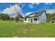 Beautiful home featuring a spacious green lawn, a modern design, and charming curb appeal at 1042 Golden Bough Rd, Lake Wales, FL 33898