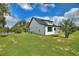 A single Gathering home with a pristine lawn, featuring a clean, minimalist design at 1042 Golden Bough Rd, Lake Wales, FL 33898