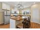 Bright kitchen with wood countertop island, stainless steel appliances, and modern light fixture at 1042 Golden Bough Rd, Lake Wales, FL 33898