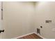 Bright laundry room with utility connections and wood-look flooring at 1042 Golden Bough Rd, Lake Wales, FL 33898