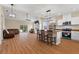Open-concept living space featuring a kitchen island, modern lighting, and seamless flow to the living room at 1042 Golden Bough Rd, Lake Wales, FL 33898